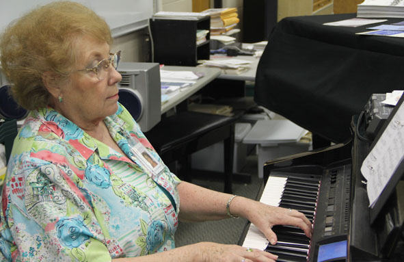 CHOIR DIRECTOR MARY ETTA COPELAND  plays the piano in her classroom. She is celebrating her 45th year of teaching at DHS this year. She is still loving teaching and cannot wait until next year. Photo by  Erin Sullivan