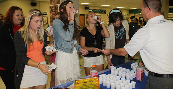 Seniors try out new food options from one of the vendors during Taste Test Tuesday. The Naked juices were some of the most popular options throughout the day. 