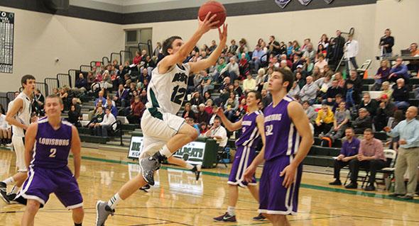 Senior Luke Stenzel scores two for his team. De Soto high school won against Louisburg 48 to 42.