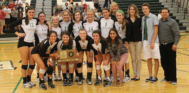 The De Soto High School volleyball team celebrates after earning a State tournament berth following the team's Sub-State championship held at De Soto High School on Oct. 25.