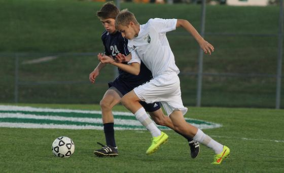 Junior center midfielder Luke Zoller races past his Eudora opponent during the DHS' 10-0 win in the opening round of Regionals on Oct. 28 at De Soto High School. 