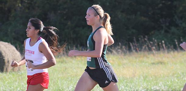 Senior Kate Barger runs during the beginning of the League race at Rim Rock Trail on Oct. 16, 2014.