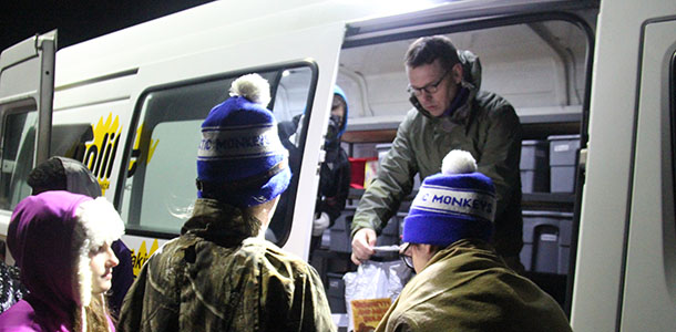 CatPride sponsor Joe Kordalski, who volunteers for the homeless outreach program Uplift, works with De Soto High School students at Campout4Cash on Nov. 20.