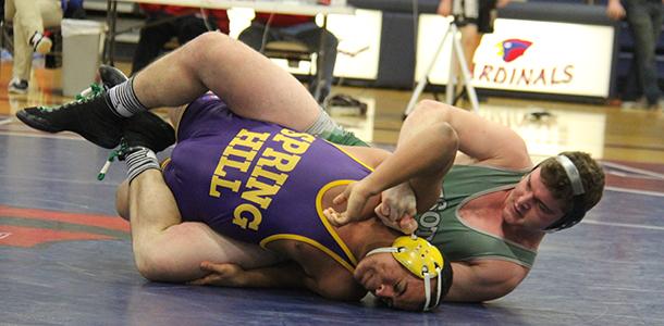 Senior Chandler Carter attempts to pin his Spring Hlll opponent at the Frontier League Tournament. 