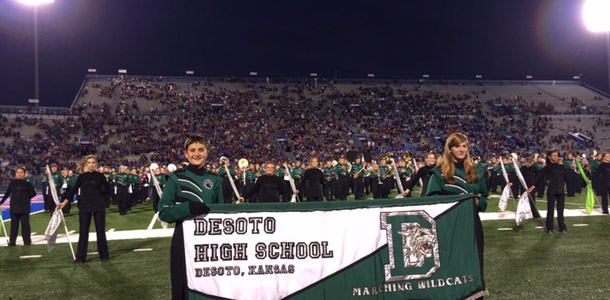 Wildcat band members pose with the DHS banner.