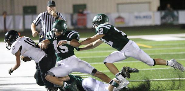 Seniors Joey Hundley and Braxton Henry tackle a Paola player on Sept. 11. This week, DHS is being featured on KMBC 9. 