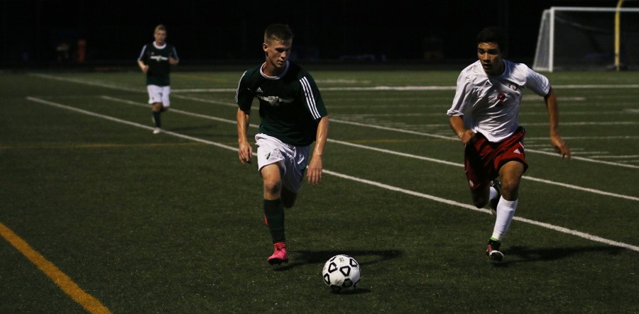 Senior Noah Lamar drives down the field at the DHS vs. Bishop Miege game on Sept. 3. Do you have any pictures of the soccer team? Contact us at dhsgreenpride@gmail.com. 