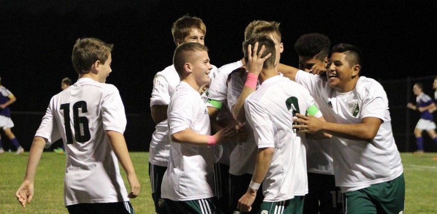 The soccer team celebrates after a goal against Spring Hill on Oct. 20. After this win, DHS won league champion; now they look to the postseason. 