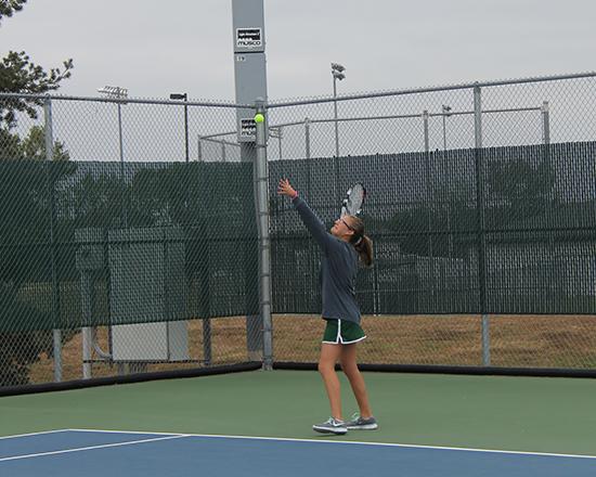 Taylor Hansen serves at Regionals.