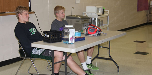 Sophomore Noah Wilson and senior Hunter Corneliusen sell raffle tickets at lunch.