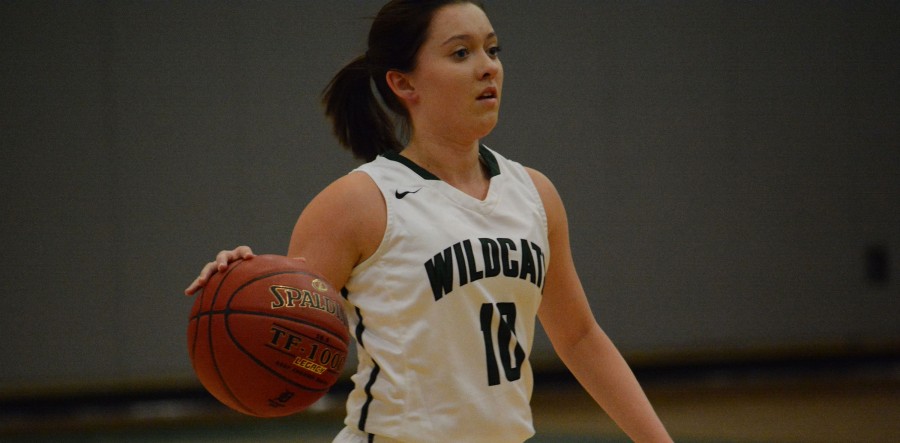 Junior point guard Tanith Beal dribbles during the game. In the Lady Wildcat's first varsity home game, they beat Southwest Early College 75-17. 