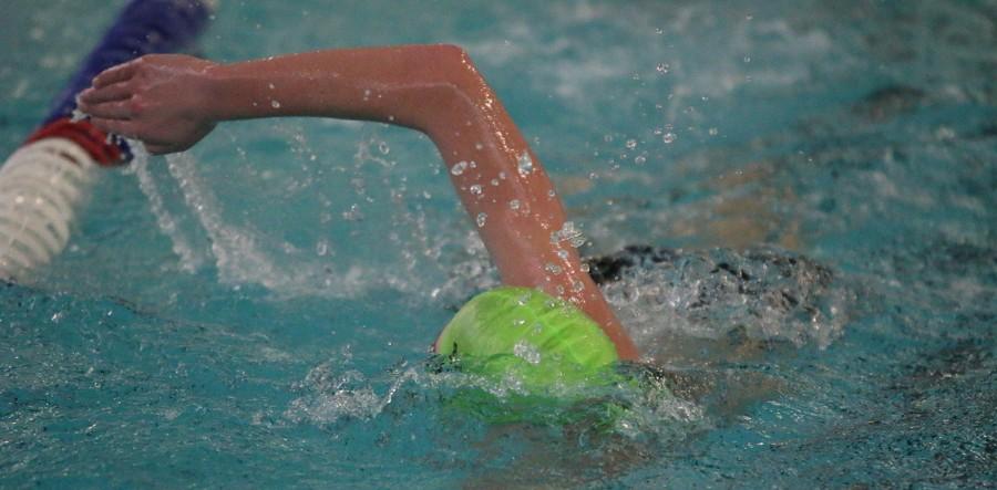 Junior Julian Longerich swims freestyle at a practice on Jan. 22.