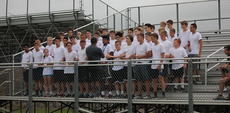 Members of the De Soto High School soccer team stand in a military-type formation awaiting instructions from Lt. Col. James Dowdy, a retired U.S. Army officer, during the team’s annual boot camp on Aug. 21. 