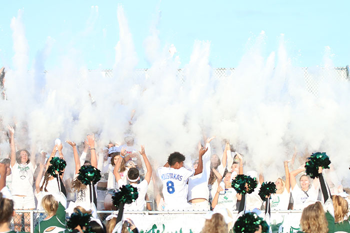 DHS student section throws baby powder for annual 'White Out' game theme at the first game of the season on Sept. 2, 2016.