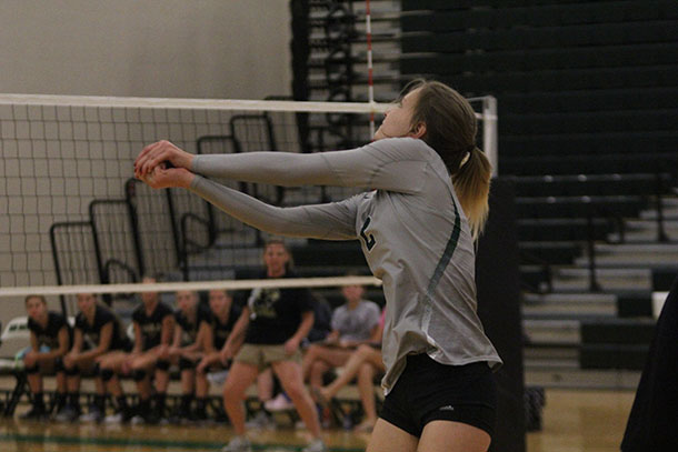 Sophomore Cassidy Crist prepares to pass a volleyball at a game against Paola High School on Tuesday, Sept. 6.