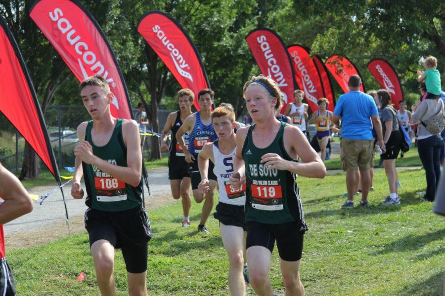 Junior Andre Vanmeerhaeghe (left) and Taylor Ramseyer (right) run past a dip in the path, halfway through the their first lap