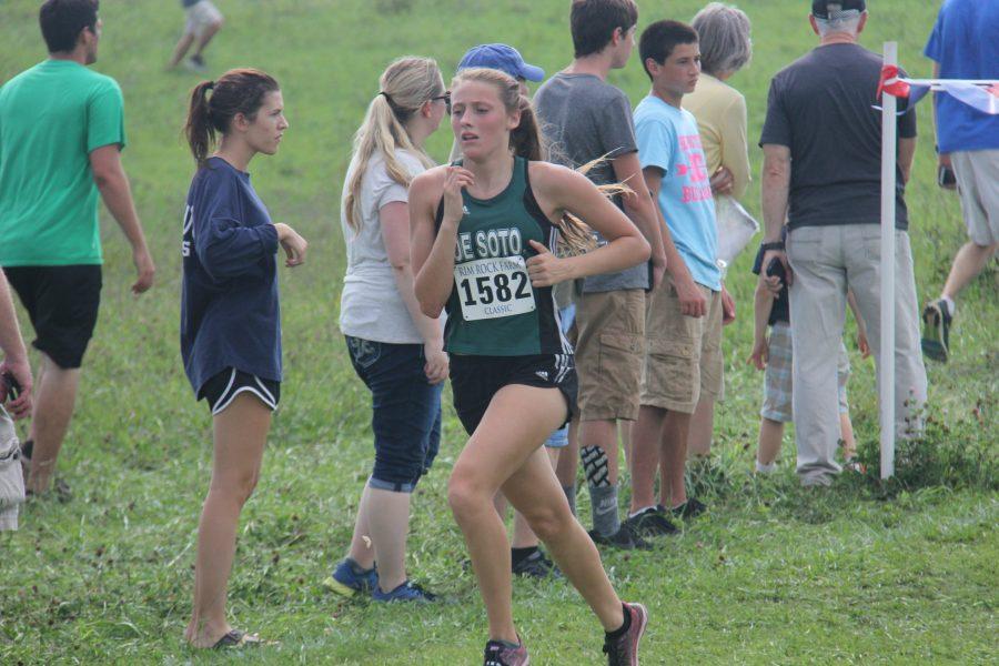 Junior Gabby Collins runs the last 50 meters of the race at Rim Rock Farm on Sept. 24