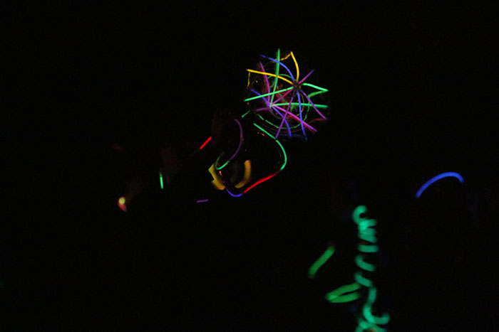 Marching band members light up their instruments at the fourth annual glow show on Friday, Oct. 21.