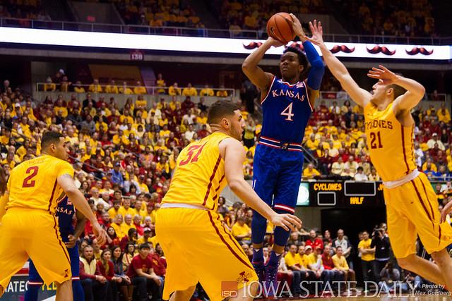 Kansas guard Devonte Graham shoots over Iowa State forward Georges Niang