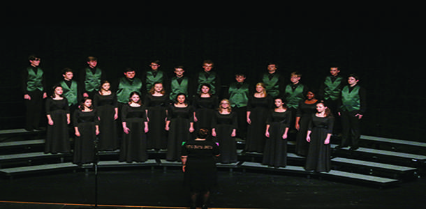 The select choir, De Soto Voce, prepares to sing I Will Be The Light at the program's first concert on Oct. 6.