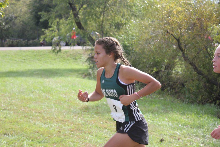 Freshman LaMyah Ricks runs around a corner halfway through the course on Oct. 1.