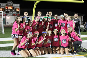 The senior team posts after their win over the junior team on the football field on Oct. 19.