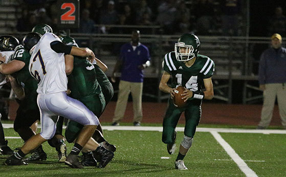 Sophomore Brandon Taylor plays quarterback in the game varsity game against Spring Hill High School on Oct. 14.