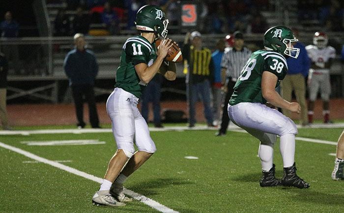 Junior Connor Strouse plays quarterback against Bishop Miege High School on Oct. 21. The Wildcats fell to BMHS 50-0.