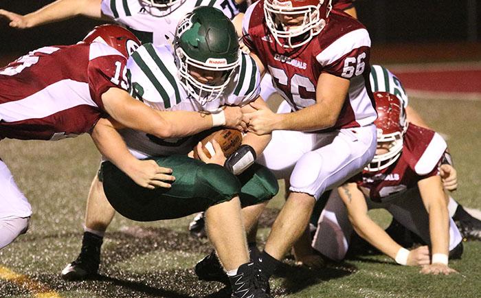 Senior Mason Clark pushes through several Eudora defenders on Oct. 28. The Wildcats eventually won 35-0 over Eudora.