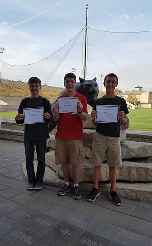 Juniors Zach Delbert, Cody Moose and Alex Webber stand with their first place certificates after the competition on Nov. 1st. 