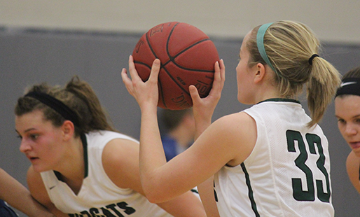 Junior Mariah Grizzle waits for senior Madison Plake to take a free throw shot at the championship game on Dec. 10