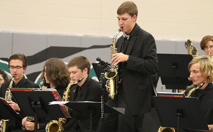 Senior Ryan Wollum performs a solo with the jazz band at the holiday concert on Dec. 1.