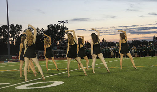 The Diamonds Dance team performs during half-time at a De Soto High School football game.