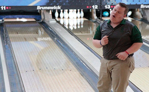 Freshman Sean Cauthron celebrates after bowling his turn in a meet. 