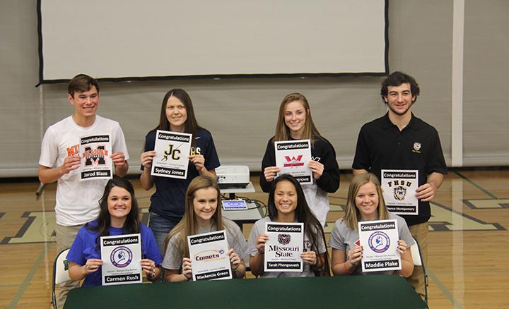 Seniors (top row) Jarod Blazo, Sydney Jones, Aly Hargrove, Chance Montgomery (bottom row) Carmen Rush, Mackenzie Green, Tarah Phongsavath and Madison Plake sign letters of intent to play their respective sports in college on Feb. 3.