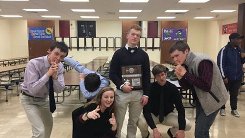 Varsity Scholars Bowl team poses with their state plaque on Feb. 2. 