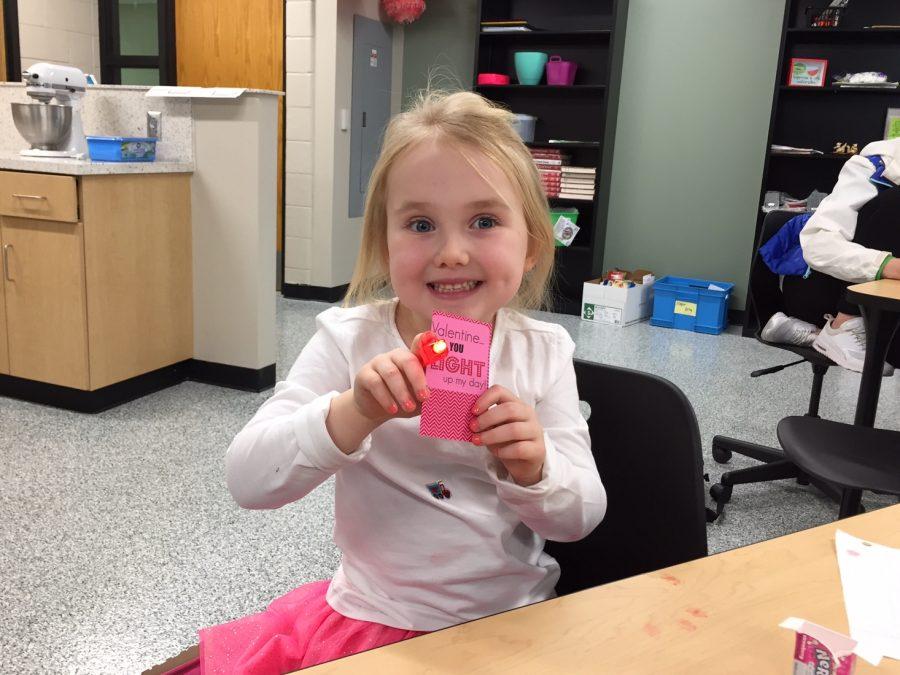 Harper Friday, daughter of FACS teacher Caroline Friday, poses with a homemade valentine.