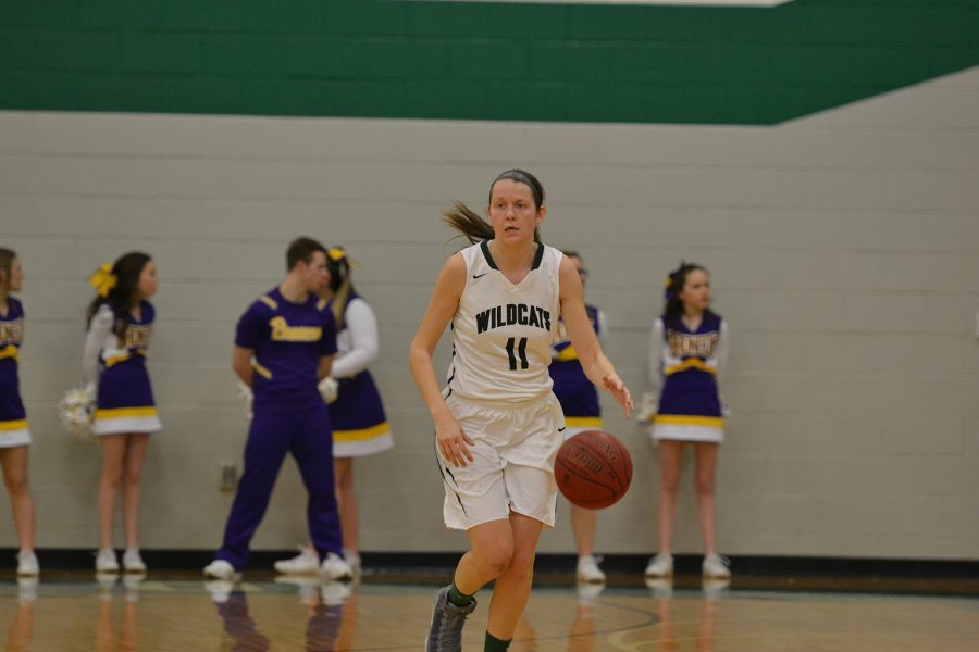 Senior Sydney Jones dribbles down the court against Spring Hill High School on Feb. 3.