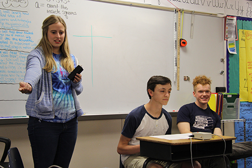 Juniors Elizabeth Seidl and Cody Moose and senior Simon Couch help run a Scholars Bowl event at Starside Elementary on April 6.