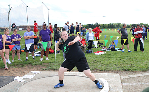 Junior Kelsey Heer competes in shot put in a home track meet.