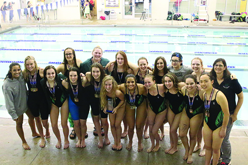 The girls' swim team poses with their medals after winning League in Osawatomie on May 10.