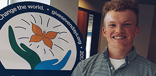 Simon Couch poses at a ceremony held by SevenDays for the winners of their songwriting scholarship competition.