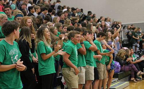 Upperclassmen mentors sing the DHS fight song with freshmen on August 16.