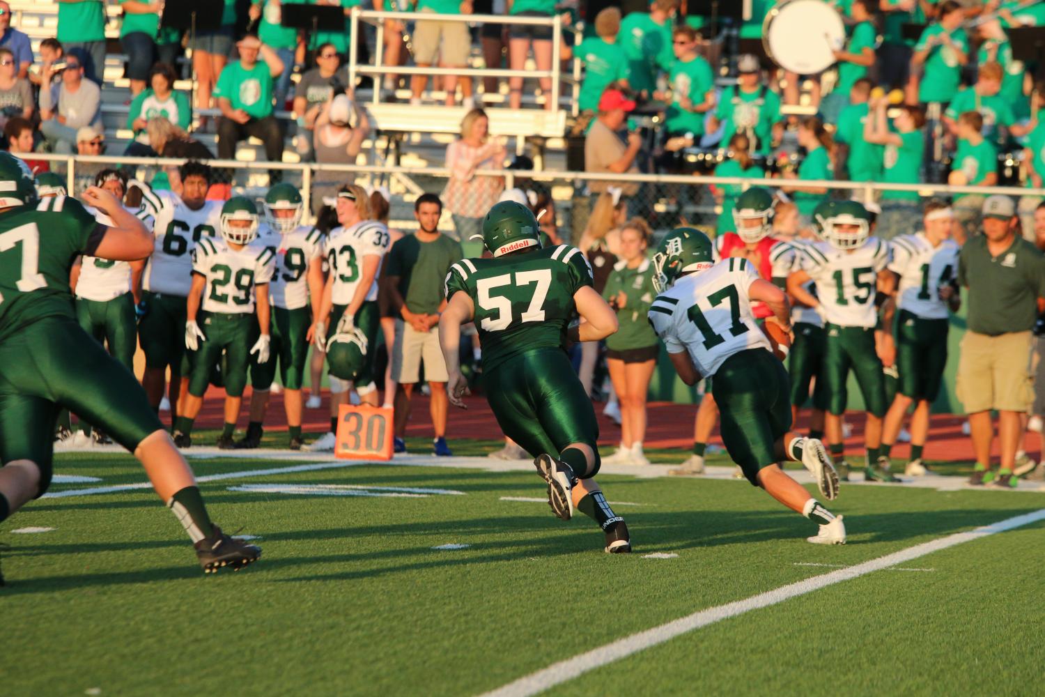 Senior linebacker Brandon Doherty chases a scrambling senior quarterback Bryce Mohl.