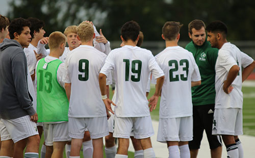 De Soto High School varsity soccer meets to strategize prior to game with Ottawa on Sept. 26.