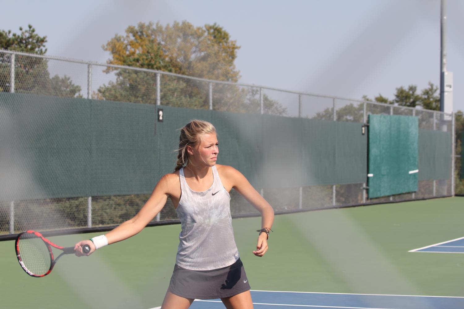 Senior Carly Bodenhausen swings for the ball 