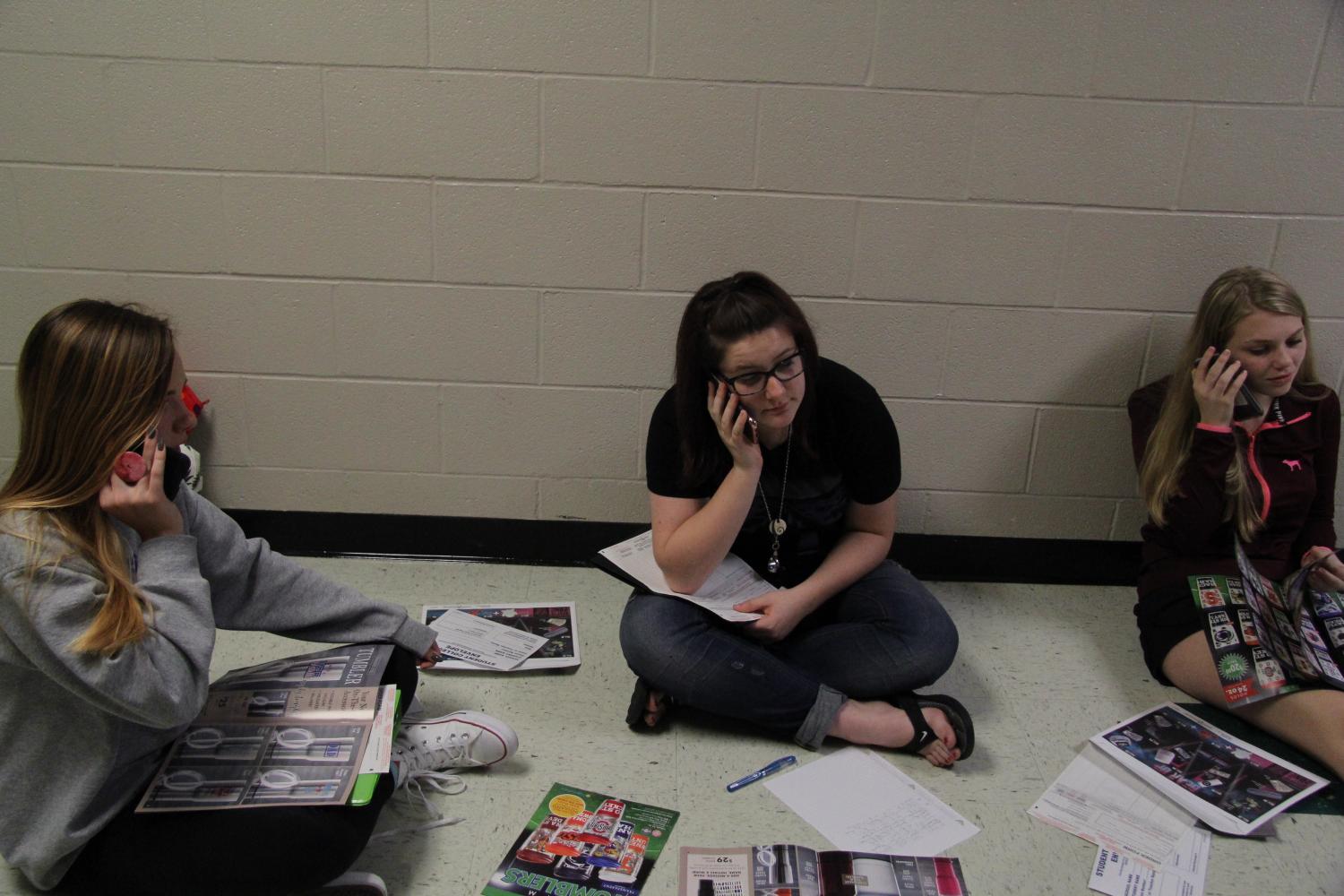 Freshman musical members making phone calls for musical fundraiser. Sep. 13 2017