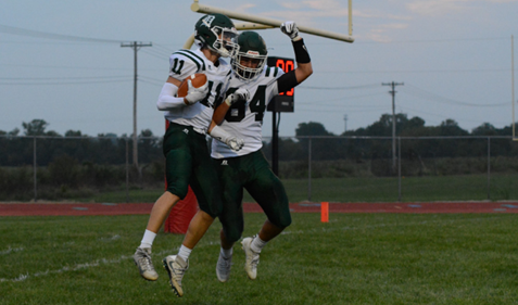 Seniors Connor Strouse and Kyle Bell celebrate after scoring against Ottawa on Sept. 1. Under the new classifications, DHS is unlikely to play Ottawa.