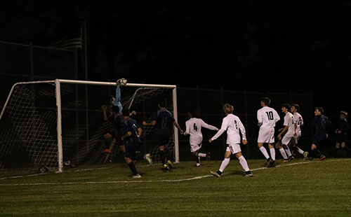 Senior Blake Webber blocks a corner kick on Oct 24.