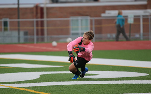 Sophomore goalie Eli Gratz warms up before the Sept. 26 game vs Ottawa.